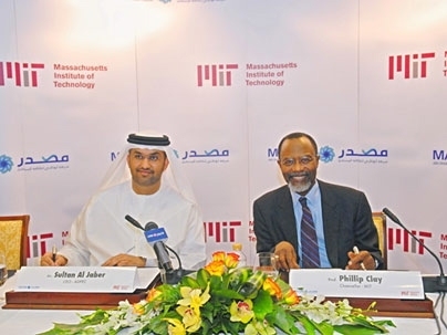 Abu Dhabi Future Energy Company CEO Sultan Al Jaber, left, and MIT Chancellor Phillip Clay prepare to sign the cooperative agreement.