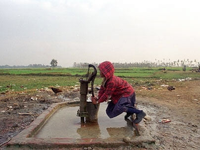 A team of eight MIT students and their advisor, Susan Murcott, brought their ingenuity and technical skills to villages in Nepal in 2002 to try to solve a very basic practical problem--the need for clean drinking water at very low cost. Here, a young girl pumps water from a well outside Lumbini, Nepal.
 <a onclick="MM_openBrWindow('nepal-girl-well-enlarged.html','','width=509, height=583')">
<sp...