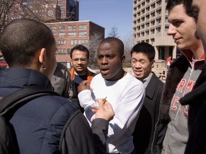 Edmund Aziabor MBA '07, center, negotiates with Saadiq Rodgers-King MBA '08, left, during a tense stand-off in "The Hunt," a new Sloan Innovation Period course.