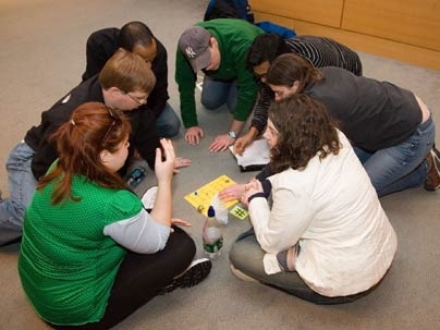 An MBA student team tries to solve the final puzzle during "The Hunt."