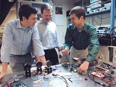 Postdoctoral associate Michel Godin, left, Associate Professor Scott
Manalis of biological engineering and postdoctoral associate Thomas Burg are part of an MIT team that has developed a technique to measure the mass of single cells.