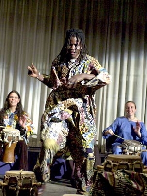 Lamine Touré (center), artist-in-residence, with Rambax members.