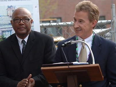 Cambridge Mayor Ken Reeves, left, applauds as MIT's Managing Director of Real Estate Steve Marsh addresses the crowd at the groundbreaking for a new building to be built on MIT property that will ultimately house the Nora Theatre and the Underground Railway Theater.