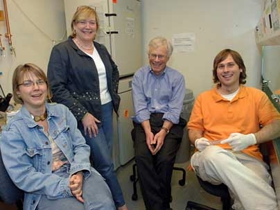 From left to right, Professors Linda Griffith and Leona Samson with Harvey Lodish of the Whitehead Institute, and graduate student Joe Shuga.