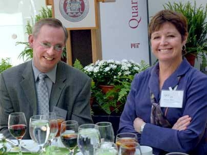 Norman Magnuson, of facilities and Diane Shea of the controller's accounting office enjoy the Quarter Century Club luncheon.