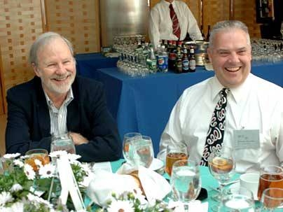 David Litster, professor of physics, left, enjoys the luncheon given for Quarter Century Club members with new inductee Joseph Orender of Lincoln Lab.