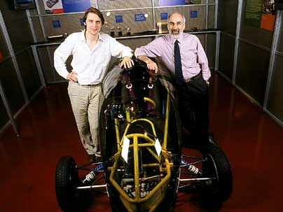 Jeroen Struben, left, and John D. Sterman, of the Sloan School, with an alternative vehicle in the MIT Museum.