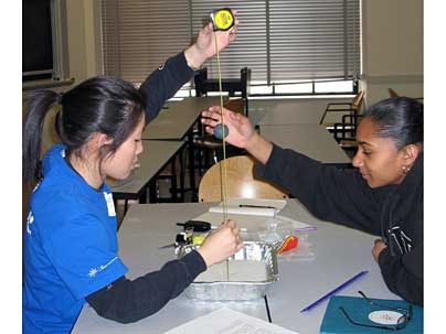 Jenny Ruan '07, left, works with eighth-grader Sabrine Sousa as part of the Public Service Center's SciPro program, which matches MIT students with teenagers in Boston and Cambridge to work on science projects.  <a onclick="MM_openBrWindow('awards-psc-enlarged.html','','width=509, height=583')">
<span onmouseover="this.className='cursorChange';">Open image gallery</span>
</a>
<noscript> <a href...