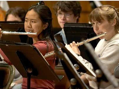 Two winners of arts awards rehearse with the MIT Wind Ensemble. At left is Christine Yu, winner of a 2007 Laya and Jerome B. Wiesner Award. At right is Lori Huberman, winner of the 2007 Louis Sudler Prize in the Arts.