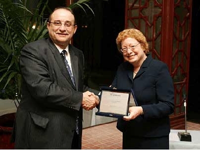 Ellen W. Faran, director of The MIT Press, receives the Grinzane-Cavour Award from Giuliano Soria, President and Founder of the Grinzane-Cavour, at the awards ceremony in Turin, Italy.
