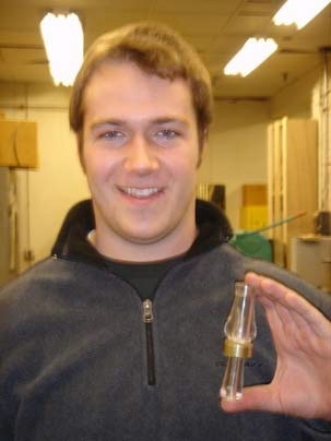 Recent graduate Cody Edwards holds one of his acrylic duck calls.