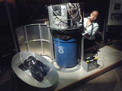 Cynthia Lin, a senior in mechanical engineering, is part of a team that built a solar-powered bottle sorter for the 2.009 product engineering class, which had the theme "reduce, reuse, recycle."