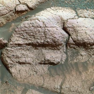 Taken by the panoramic camera on the Mars Exploration Rover Opportunity, image shows a close up of the rock dubbed 'El Capitan.'  The iron-bearing mineral jarosite, which was found in the rock, led MIT and Harvard researchers to posit that early Mars may have had the greenhouse gas sulfur dioxide in its atmosphere.