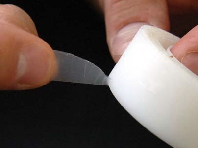 Pedro Reis, an instructor in applied mathematics at MIT, and colleagues have reported the formulation and physics behind the pattern created by adhesive tearing. In this image, Reis demonstrates the way that adhesive tape tears in a triangular shape coming a point.