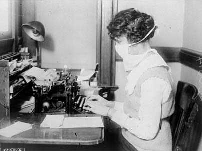 A typist wears a mask in New York during the 'Spanish flu' influenza pandemic of 1918. A new study by MIT graduate student Peter Doshi finds that death rates in pandemic seasons were no higher than--and were sometimes exceeded by--those for severe nonpandemic seasons.