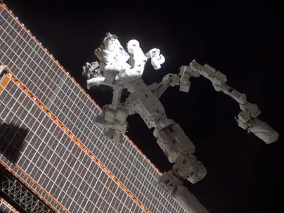 In the grasp of the station's robotic Canadarm2, Dextre, also known as the Special Purpose Dextrous Manipulator, is featured in this image photographed by a crew member on the International Space Station.