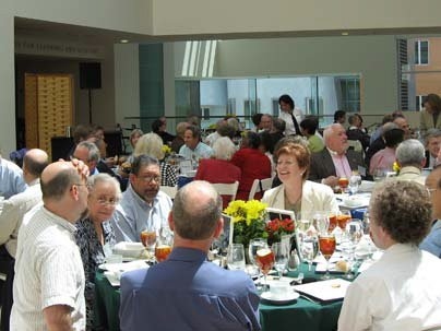 New members talk during the induction ceremony.
