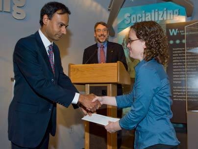 Sarah Finney receives the Carlton E. Tucker Teaching Award announced by associate dept. head Duane S. Boning and handed to her by associate dept. head Srini Devadas.