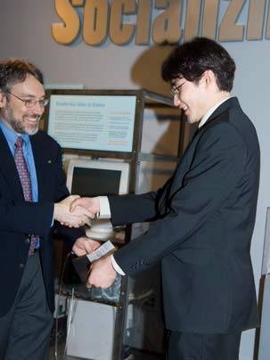 Yasuhiro Shirasaki receives the Morris Joseph Levin Award for Best MasterWorks Oral Thesis presentation from Assoc. Dept. Head Duane S. Boning.