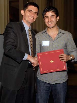 Department of Civil and Environmental Engineering head Professor Patrick Jaillet congratulates Jose Alberto Ortega on winning the Maseeh Award for excellence as a teaching assistant. The graduate student from Cuenca, Ecuador, was nominated by the faculty and students he assisted in 1.050 Engineering Mechanics I.
