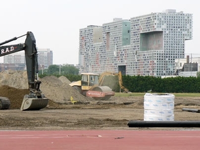 Construction crews work on tearing up the grass at MIT's Steinbrenner Stadium to make way for synthetic grass turf. The renovation was made possible by a $2 million gift from Bob and Eveline Roberts, whose daughter Julia plays on the women's soccer team.