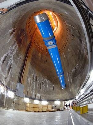 The last of 1746 superconducting magnets is lowered into the LHC tunnel via a specially constructed pit at 12:00 on 26 April. This 15-m long dipole magnet is one of 1232 dipoles positioned around the 27-km circumference of the collider. Dipole magnets produce a magnetic field that bends the particle beams around the circular accelerator.