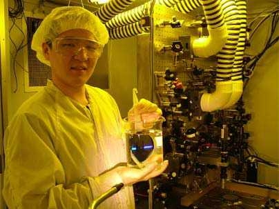 MIT graduate student Chih-Hao Chang of the Department of Mechanical Engineering holds a silicon wafer in front of the MIT nanoruler, a tool he and colleagues have used to create finer patterns of lines over larger areas on microchips.