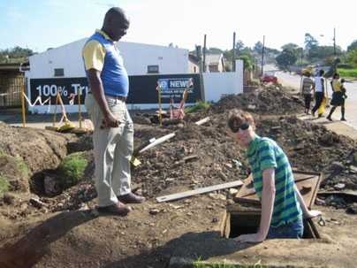 MIT graduate student Tijs Van Maasakkers, right, examines one of the water lines near Durban, South Africa.