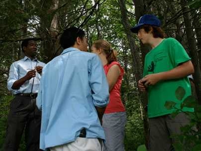 MIT visiting professor Dale Joachim, left, talks to students in a project to better listen to and learn from the natural world.
