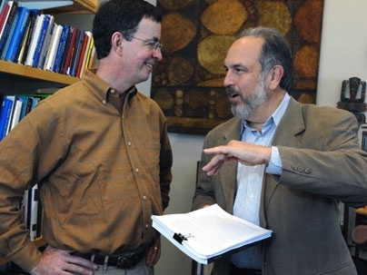 Graduate student in urban studies and planning Michael Hogan, left, and Larry Susskind, Ford Professor of Urban and Environmental Planning, discuss Hogan's thesis on government rules and renewable energy technologies.