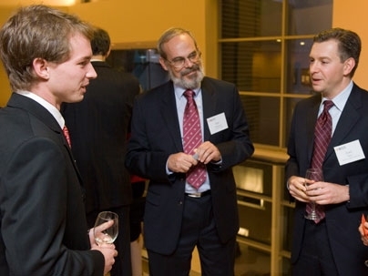 MIT Professor Eric Grimson, center, and alumnus Jake Seid, right, talk with Scot Frank, a senior in EECS who has gone on several MISTI internships, during the MISTI 25th anniversary celebration.