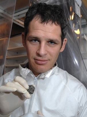 Professor Benjamin Weiss, of the department of Earth, Atmosphere and Planetary Sciences, reports oldest known records of planetary magnetic fields, which are a key to understanding earlyÂ planetary evolution. Here he holdsÂ a sample of the vesicular basaltic meteorite named D'Orbigny that he analyzed as part of this study.