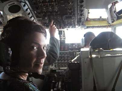 Department of Materials Science Associate Professor Christine Ortiz in the cockpit of an Air Force KC-135 Jet during landing on a Defense Science Study Group trip.