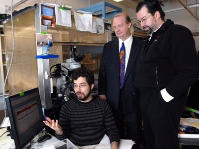 Ed Boyden, seated, Rutledge Ellis-Behnke, middle, and Joost Bonsen,  met in Boyden's lab to discuss the class they teach together on neurotechnology as a discipline.