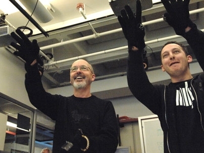 Video artist Bill Viola, left, tries out the 'wall' in the Tangible Bits lab with the help of graduate student Jamie Zigelbaum.