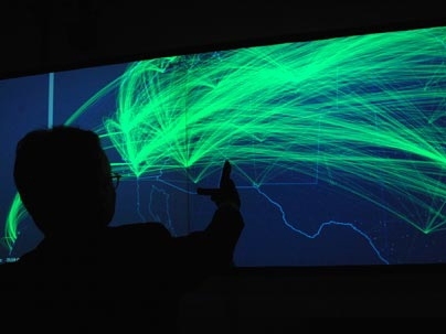 Ishii works with the g-speak "wall" interactive control system in his Tangible Bits Lab.