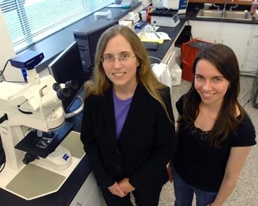 Carol Livermore, associate professor of mechanical engineering, left, stands with graduate student Frances Hill in Livermore's lab.