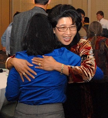Greer Swiston '87 and Jhanavi Pathak '11 meet at the Community Catalyst kick-off event. 