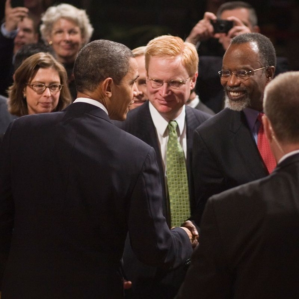 MIT Chancellor Phillip Clay shakes hands with President Barack Obama as Vice President for Institute Affairs and Secretary of the Corporation Kirk Kolenbrander looks on.