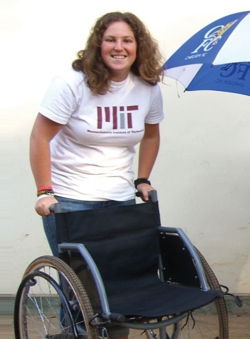 Tish Scolnik poses with a folding three-wheeled wheechair prototype.
