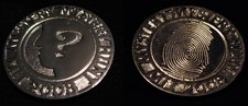 The 2008 Mystery Hunt Coin featured the thumbprint of Dr. Awkward's murderer, whom hunters had to identify.