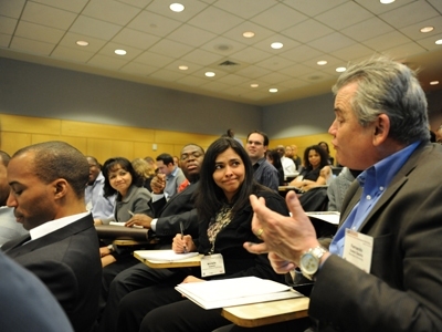 Michele Manuel (left) of the University of Florida and Fernando Colon Osorio (right) from Brandeis University converse during one of the workshop sessions about the art of strategic persuasion.