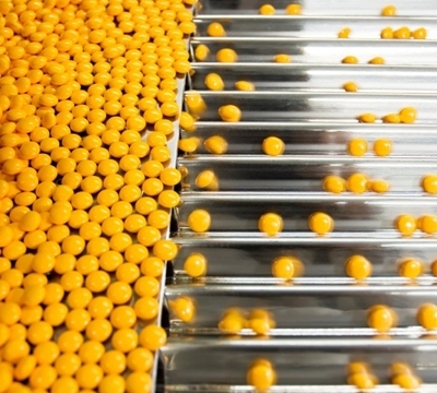 Pills are fed through a sorter in a pharmaceutical manufacturing facility. New manufacturing methods in industries such as drug production may be a key to reviving the United States economy.