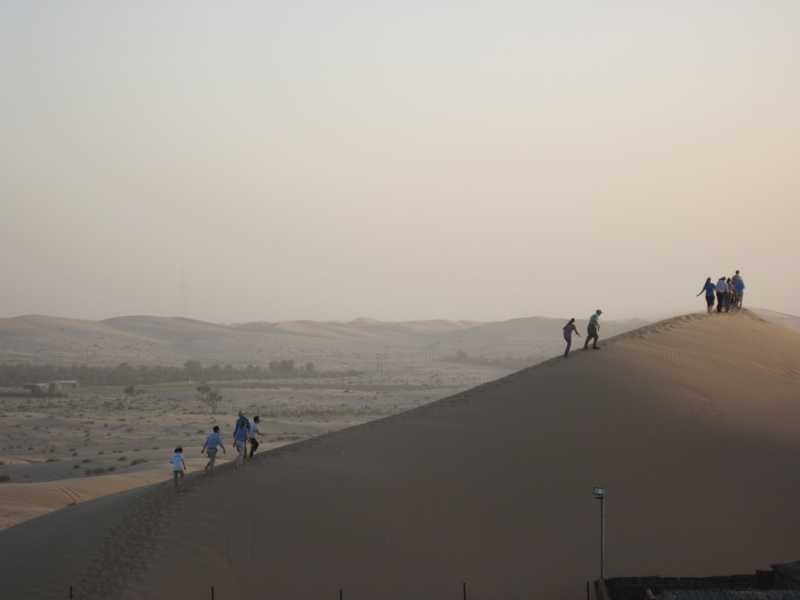 Part of the group’s guided tour of Abu Dhabi included a desert safari. Here they climb up one of many sand dunes.