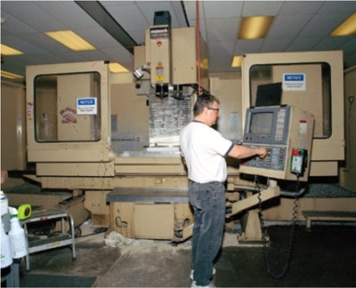The Laboratory’s machine shop is capable of precision machining of both intricate and large-scale parts. Shown here is a five-axis, computer-controlled milling machine used in fabricating the parts.