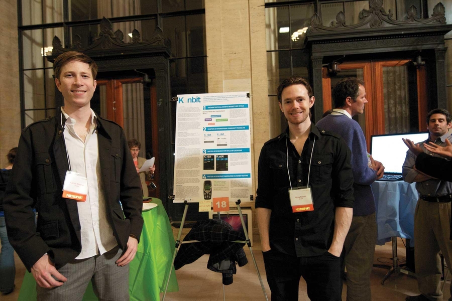 Graduate students Aaron Zinman and Greg Elliott at the IDEAS Competition Project Display and Judging Session.