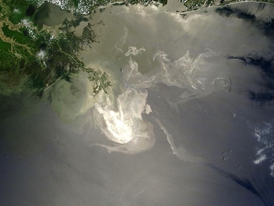 This image, taken by NASA's Terra satellite, shows the growing oil slick in the Gulf of Mexico reflected by the sun.