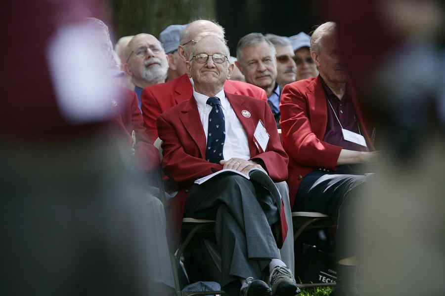 Beginning at their 50th reunion, MIT alumni don a "Red Coat" and those celebrating this milestone are honored each year at commencement. Here, a member of the Class of 1960 watches the Commencement proceedings.