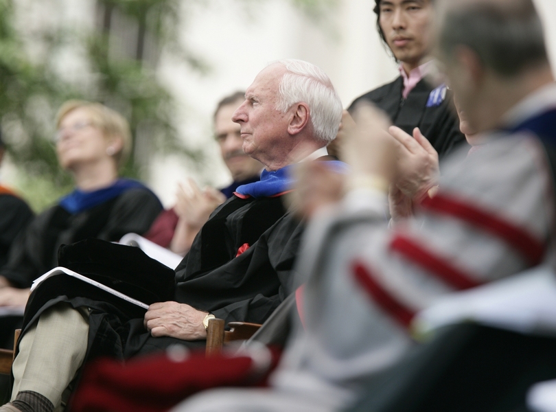 Commencement speaker Raymond S. Stata ’57 listens during the ceremony.