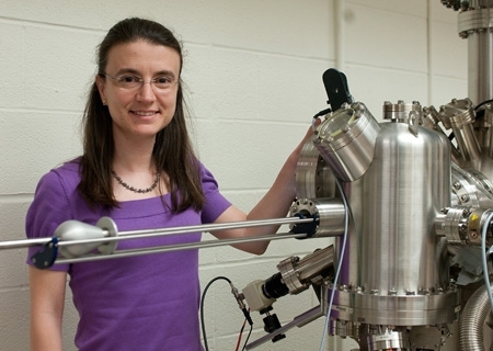 Professor Bilge Yildiz with a surface science system including a variable temperature scanning tunneling microscope (STM), non-contact atomic force microscope (nc-AFM), and X-ray photoelectron spectrometer. The system enables users to perform STM/nc-AFM measurements at elevated temperatures and reactive gas environments.